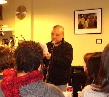 Linh Đinh reading at the Muddy Waters Café in San Francisco, 2007. Photo by Barbara Jane Reyes