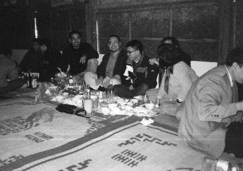 From left to right: Nguyễn Quốc Chánh, Linh Đinh and Phan Nhiên Hạo, with Nguyễn Quang Thiều obscured by Nguyễn Thị Minh Thái, in Hanoi, 1999